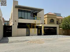In Rawda 2, a 5000 sq ft two-story villa with five master bedrooms, a majlis, two living rooms, a mo