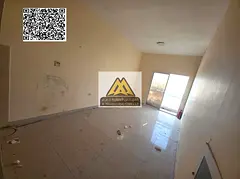 A spacious studio for annual rent in Al Hamidiya – Ajman, featuring a balcony with an open view in