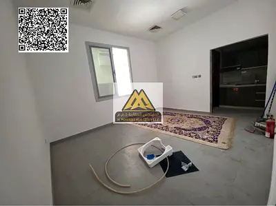 A spacious ground-floor studio for annual rent in Al Rawda 1 – Ajman, featuring a semi-separated kitchen, central AC, and located in a new building in
