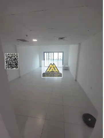 Studio for rent in Al Rashidiya, Falcon Towers, with balcony and free parking. 24,000 AED yearly, 4 payments. Prime location close to services, great