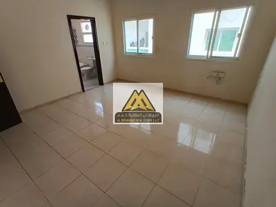 Two-bedroom apartment with living room in Al Nuaimiya 2, Ajman, on King Faisal Street, central AC, free maintenance, AED 34,000, 4 installments, excel