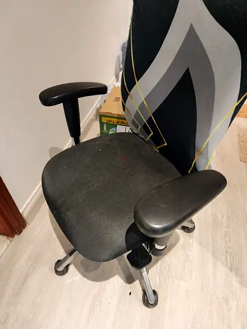 Used ergonomic office chair with adjustable armrests