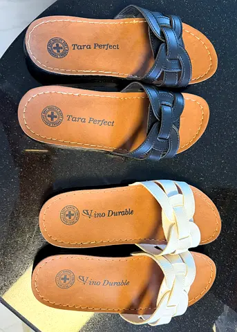 Two pairs of womens braided slip-on sandals (black and white) - lightly used