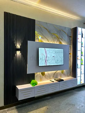 Modern wall-mounted entertainment unit with backlit display panels
