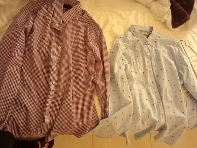 Two mens casual long-sleeve shirts – checked red and printed white, size M/L