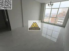 A 2-bedroom apartment with a living room for annual rent in Al Jurf 3 – Ajman, located in a new bu