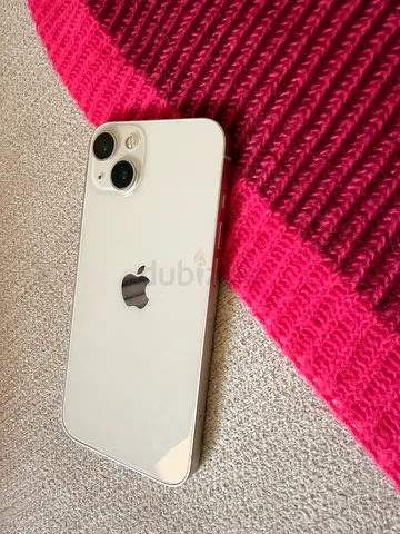 iPhone 13 in white color with 128 GB storage.