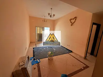 1-bedroom apartment with a living room, balcony, 2 bathrooms, and a spacious layout, located next to Al Hikma School.