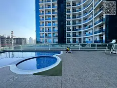 For sale: One bedroom and living room in Al Waha Towers, Ajman, with gym, swimming pool, and parking