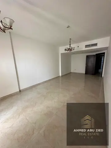 Largest two-bedroom apartment with a living room in Sharjah, ready for immediate occupancy. Includes parking, gym, and swimming pool, with a balcony o