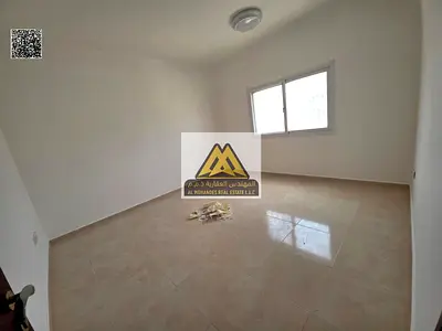 Two-bedroom apartment with living room in Al Jurf 2, Ajman, spacious, family building, near the university and services, AED 36,000 in 4 installments,