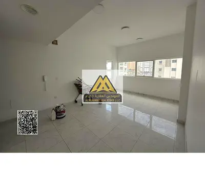One-bedroom apartment with living room in Al Nuaimiya 1, Ajman, large space, balcony, built-in wardrobes, prime location near Al Hikma School and Emir