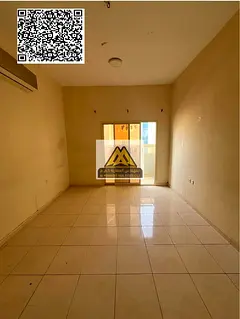 A 1-bedroom apartment with a living room for annual rent in Al Nuaimiya 2 – Ajman, featuring a spa