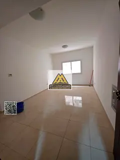 One-bedroom apartment with hall in Al Jurf 2, balcony, near Ajman University, lively and serviced lo