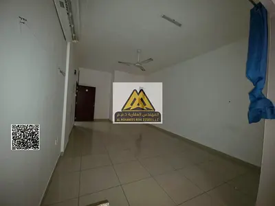 Spacious studio in Al Rawda 2, Ajman near City Centre. Semi kitchen, large bath. AED 19,000 yearly, 6 payments. Prime location.