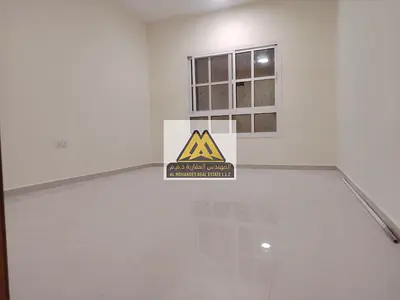 One-bedroom apartment with hall in Al Rawda 2, open view balcony, family building, large space. 29,000 yearly, 4 payments, prime location, close to se