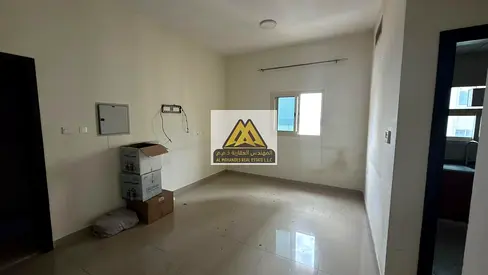 One-bedroom apartment with living room available for annual rent in Al Nakheel 1, Ajman. Central air conditioning, parking, and two bathrooms.