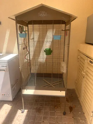 Large metal bird cage with wheels and accessories