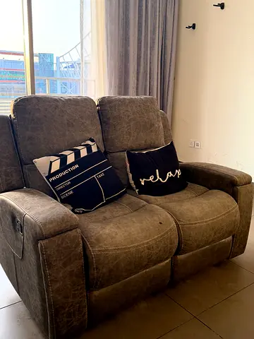 Two-seater reclining sofa in gray faux leather