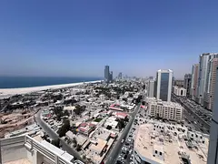 For annual rent: a fully furnished, luxurious rooftop apartment in Ajman Corniche, with an exception