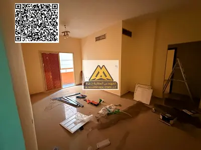 A 2-bedroom apartment with a living room for annual rent in Al Nuaimiya 2 – Ajman, featuring central air conditioning and a practical layout, located