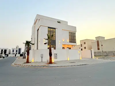 Own a corner villa in Al Zahia area, 7 rooms with elevator and roof | Freehold | Includes water, electricity and central air conditioning fees.