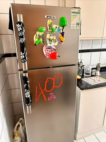 Silver double-door refrigerator, good working condition