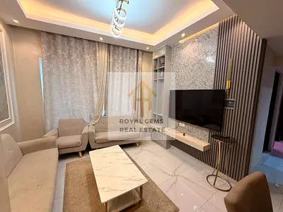 Luxuriously furnished two-bedroom apartment with a living room and private parking.