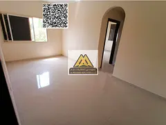 A 1-bedroom apartment with a living room for annual rent in Al Nuaimiya 2 – Ajman. It features a g