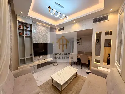 Luxuriously furnished two-bedroom apartment with a living room and private parking.