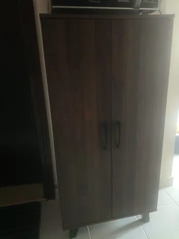 Dark wood two-door storage cabinet / wardrobe - good condition