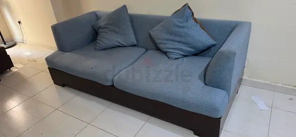 3-seater fabric sofa with wooden base — light blue, good condition