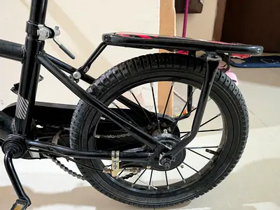 Kids 12-inch Black Bicycle with Training Wheels and Rear Rack - Good Condition - chain loose small.