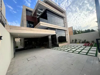 Luxury villa for sale in Rawda 1 | 5000 sq ft | Two floors + roof | 7 bedrooms | Majlis and 2 living rooms | Main kitchen + preparation kitchen | Cent