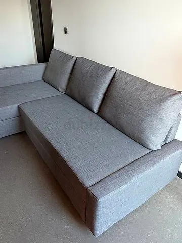 Light grey L-shaped fabric sofa - good condition