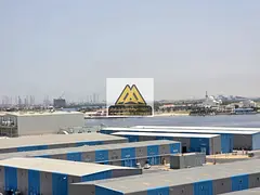 One-bedroom apartment for rent in Liwara 1 with sea views of the creek and Ajman port, featuring two