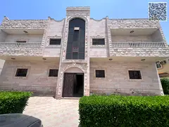 For rent at a bargain price: a large, two-bedroom apartment in Al-Muwayhat 2