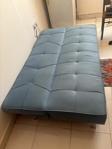 Light blue tufted sofa bed - used, good condition