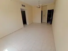 In Al Qulaya'a area of ​​Sharjah, a two-bedroom apartment with a living room, two bathrooms,