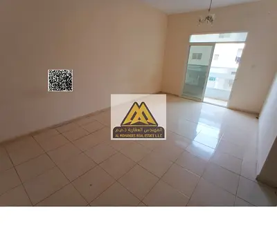 Two-bedroom apartment with hall in Al Nuaimiya 2, King Faisal Street. 34,000 AED, 4 payments. Central AC, free maintenance, excellent space, prime loc