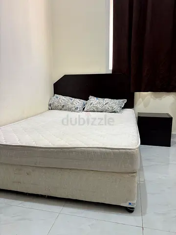 Queen bed frame with headboard and mattress - good condition with side table