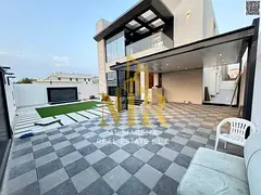 Luxury Villa in Al Muwaihat 2: Modern Design with Yard, Outdoor Seating Area, and Central Air Condit