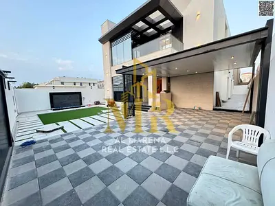 Luxury Villa in Al Muwaihat 2: Modern Design with Yard, Outdoor Seating Area, and Central Air Conditioning - Freehold A luxurious villa in Al Muwaiha