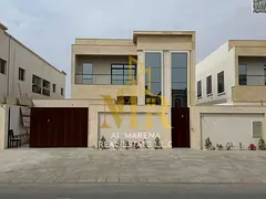 Two-story villa for sale in Al Rawda 3, Ajman. Price includes electricity, water, and air conditioni