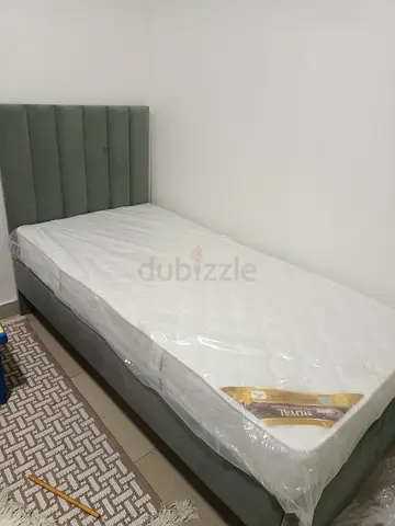 Hi I am selling single bed with matters brand new