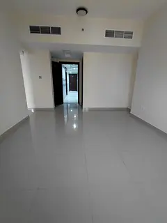 A spacious two-bedroom apartment with a living room is available for annual rent in Al Majaz 3. The
