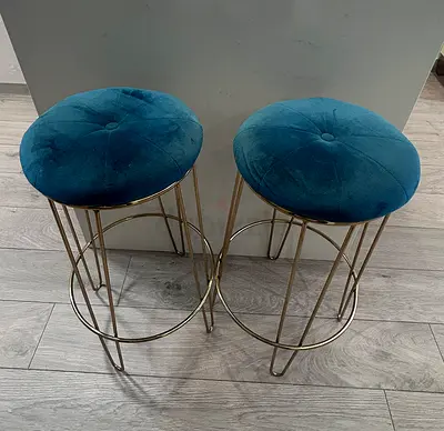 Pair of teal velvet round bar stools with gold metal frame