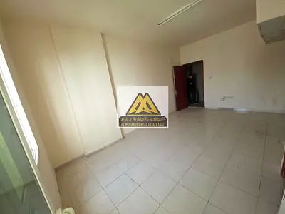 Studio for Rent in Al Rawda 1 Ajman Balcony Open View Near Kanz Mall Central AC Prime Location on Main Road