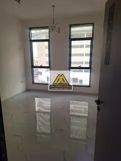A 1-bedroom apartment with living room is available for annual rent in Al Alia Ajman located in a ne
