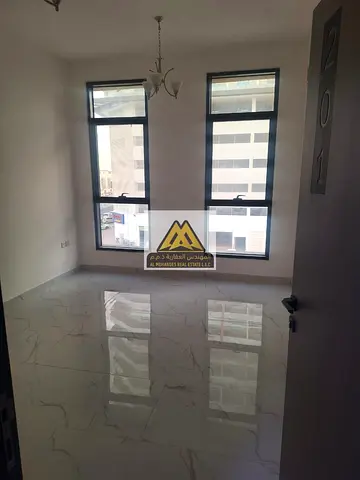 A 1-bedroom apartment with living room is available for annual rent in Al Alia Ajman located in a new building with a spacious layout and a comfortab